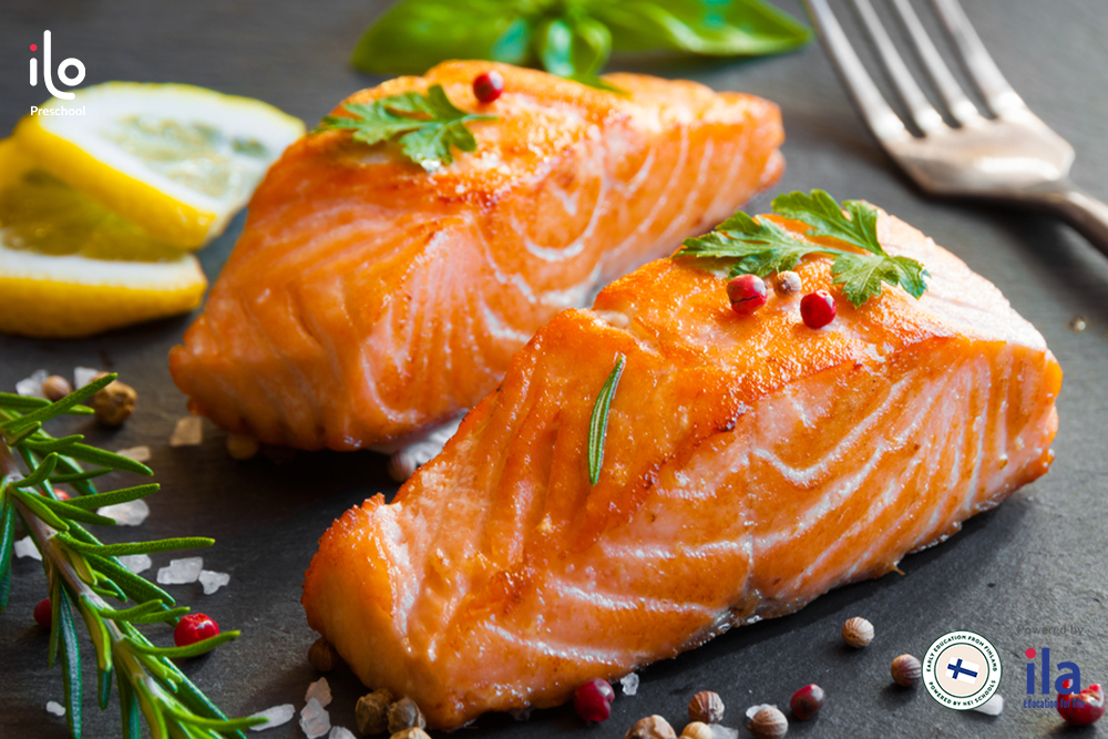 Salmon with garlic butter sauce is attractive for 2-year-olds.  